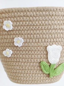 Handwoven light brown cotton rope basket bag with delicate crochet tulip and flower decor