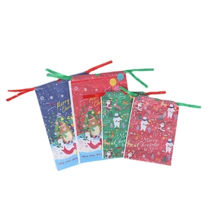 Red and green Christmas PE drawstring gift bags in multiple sizes with holiday patterns