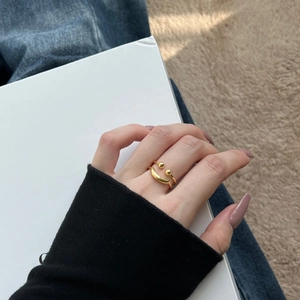 Close-up of minimalist gold S925 sterling silver hollow smiley face ring on model's hand