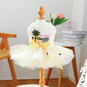Close-up of Pineapple Princess pet dress with waffle texture and yellow satin bow detail