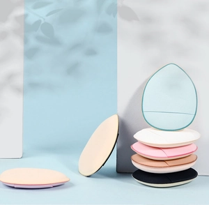 Close-up of multi-colored teardrop and oval mini finger powder puffs for makeup