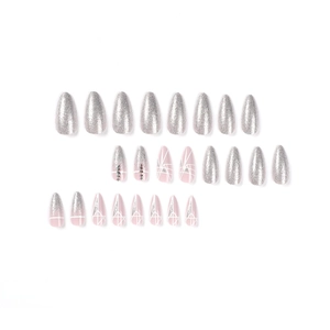 Glitter almond press-on nails with pink geometric lines and rhinestone accents