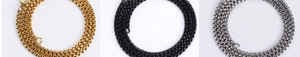 Detailed close-up of box chain necklaces in gold, black, and silver stainless steel