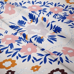 Detailed close-up of textured fabric showing colorful floral patterns and soft folds