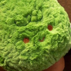 Cute green plush Christmas tree pillow with soft long fur and smiling embroidery