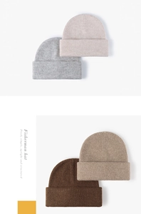 Detail view of four winter beanies in grey, beige, and brown with ribbed knit texture