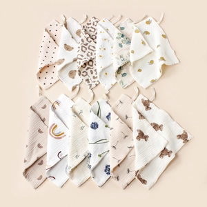 Soft 12-pack muslin baby washcloths with hanging loops and cute diverse patterns
