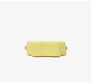 Close-up of yellow PVC jelly bag featuring beaded texture and gold D-ring hardware