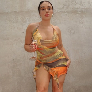 Detail of summer tie-dye two-piece set featuring halter top with metal ring and mesh skirt