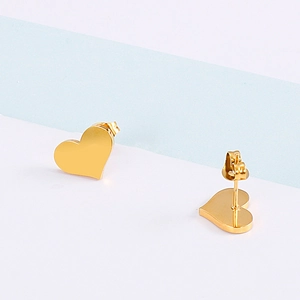 Elegant gold plated stainless steel heart stud earrings for women on a minimal background