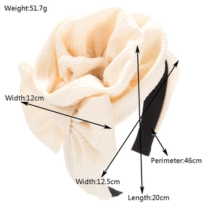 Chic oversized cream fabric flower headband with 12cm bloom and 46cm perimeter measurements