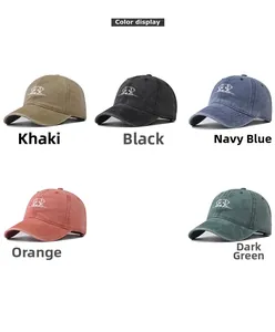 Color display of five washed cotton baseball caps featuring embroidered dog designs