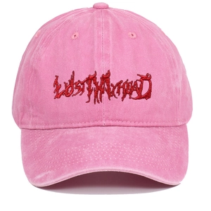 Washed pink cotton baseball cap with red gothic LOST MY HEAD embroidery on plain background