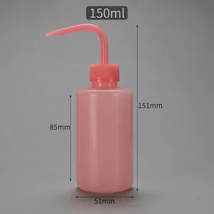 Close-up of pink 150ml plastic squeeze wash bottle with curved narrow nozzle and scale