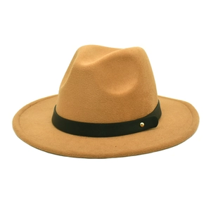 Detail of camel wool fedora hat featuring a black leather belt with a golden metal buckle