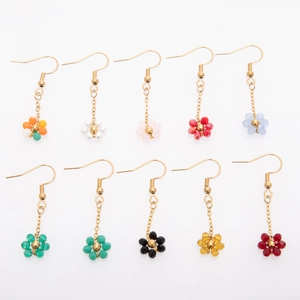 Detailed close-up showing ten colorful beaded flower dangle earrings on gold hooks