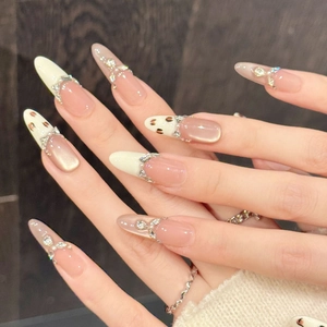 Handmade pink gradient press-on nails with leopard print and rhinestone accents