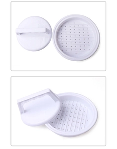 Close-up of a white plastic round burger press mold with two components for kitchen use