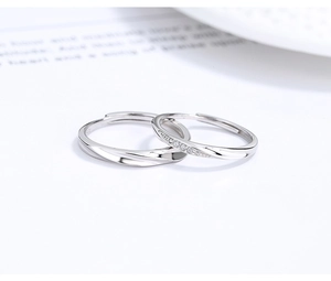 Detailed close-up of S925 sterling silver couple rings with twisted rope pattern details