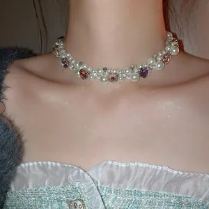 Elegant multi-layer pearl necklace featuring crystal heart pendants and sparkly rhinestones