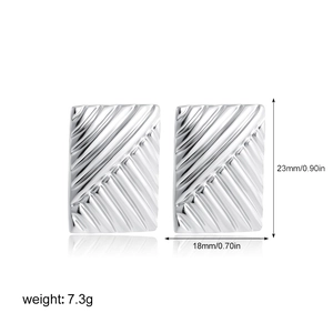Detailed view of silver rectangular earrings with texture showing 23mm height and 18mm width