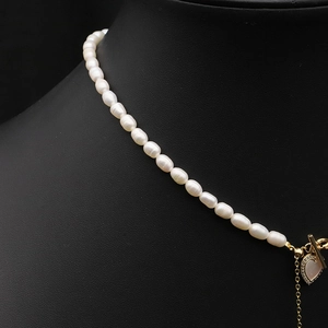 Elegant natural freshwater pearl necklace with gold heart pendant and toggle clasp