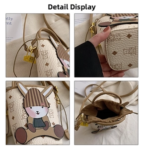 Detail view showing drawstring bucket bag texture, cartoon rabbit and inner space