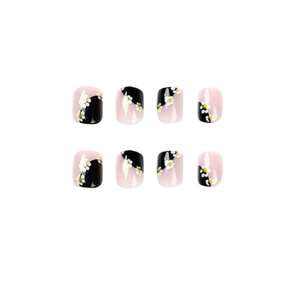 Faux ongles courts carrés au design minimaliste de marguerites noires et roses