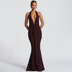 Detailed view of the deep red pleated V-neck backless dress with jacquard texture