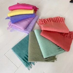 Set of soft thick cashmere-like scarves in various colors with fringe details and tassels