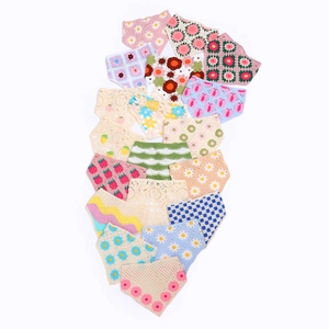 Detailed view of hand-crocheted floral headscarves with daisy and strawberry patterns