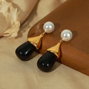 Gold-plated teardrop earrings with white pearls and black resin stones on silk