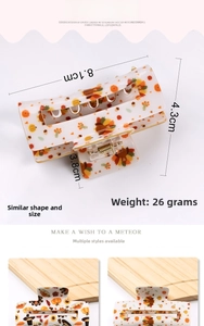 Detail view of Thanksgiving hair claw clip with turkey and pumpkin patterns, 8.1cm size