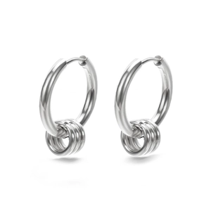Detailed macro view of minimalist silver hoop earrings with three small hanging rings