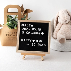 Detailed view of wood felt letter board with tripod stand and white DIY characters