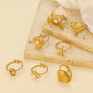7-piece gold ocean themed adjustable ring set featuring crab, starfish and sea turtle shapes