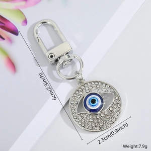 Detail view of the Evil Eye keychain with blue eye pendant and clear rhinestones size specs