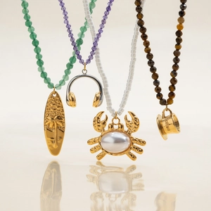 Beaded necklaces with 18K gold stainless steel pendants featuring crab and pearl charms