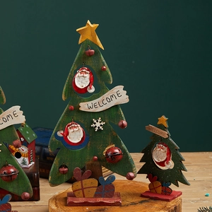 Miniature wooden Christmas tree decorations with hand-painted Santa and star ornaments