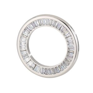 Silver round eternity ring with rectangle cut clear gemstones on white background