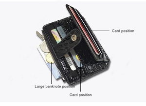 Detail view of black crocodile pattern card holder with zipper pocket and multi-slots