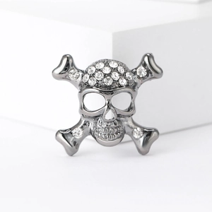 Punk style skull brooch with sparkling rhinestones in a dark grey metallic finish