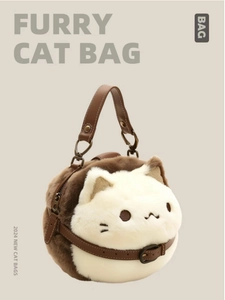 Detail of furry cat plush handbag featuring brown leather strap and soft long faux fur