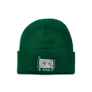 Close-up of dark green beanie featuring white anime embroidery and Japanese text