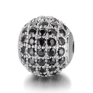 Macro shot of silver-plated bead with micro-pave black cubic zirconia stones