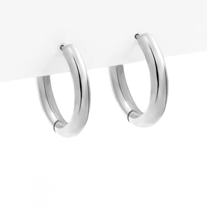 Detailed view of silver geometric hoop earrings with a high-polished metallic finish