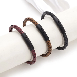 Three braided leather bracelets in burgundy, brown, and black with black magnetic clasps