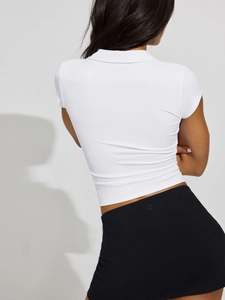 Detailed back view of white slim-fit polo shirt showing knit texture and athletic cut