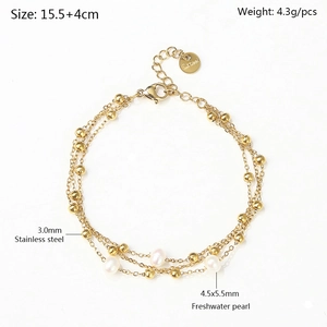 Detailed view of triple-layered golden stainless steel bracelet with freshwater pearls