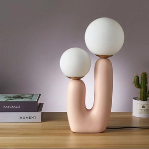 Modern pink U-shaped ceramic LED lamp with two white frosted glass globe shades for bedroom